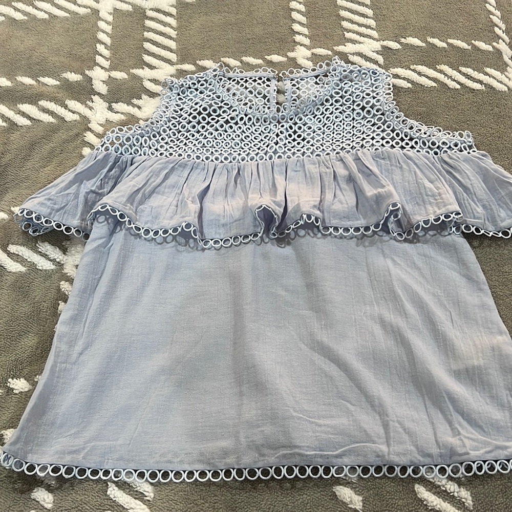Like New cold shoulder top straight from Paris. Size small/medium (no size).